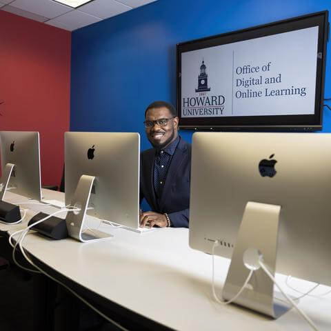 Image of Morris Thomas sitting at a computer